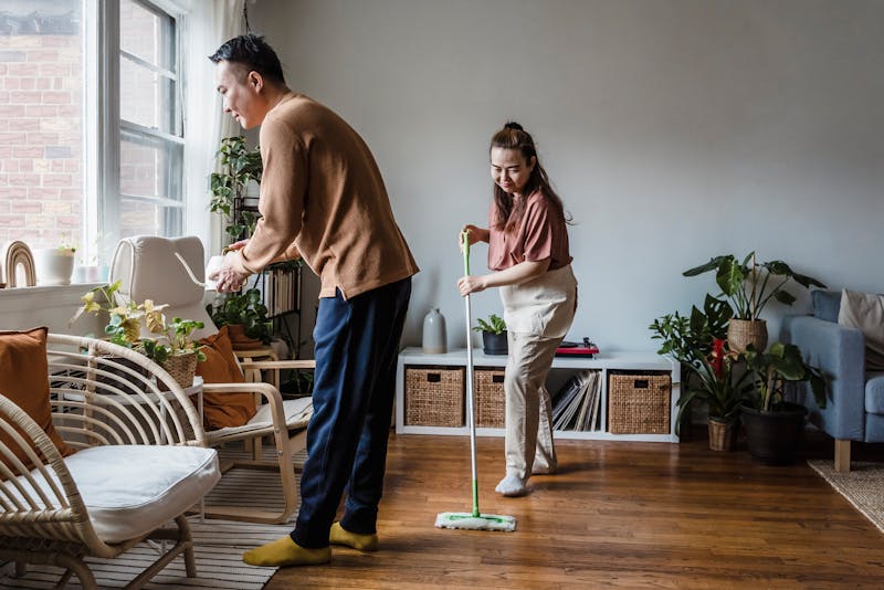 a couple cleaning their house